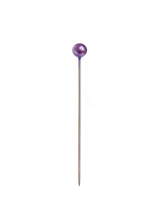 a single pin with a purple head on a white background の写真素材