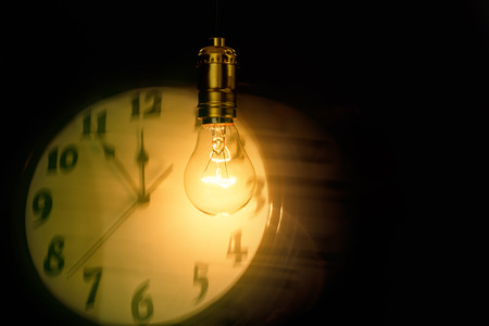 Light bulb and clock, concept of idea.の写真素材