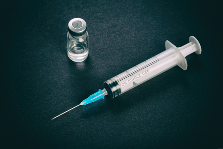 single use Medical syringe white dark background の写真素材