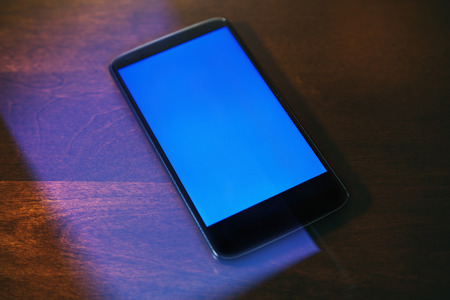 showing smartphone with blank screen. business communication concept.の写真素材
