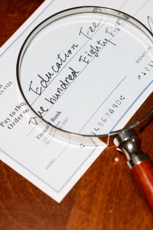 Fake cheque,  cheque for education fee, financial concept.