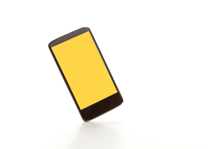 showing smartphone with yellow screen. Isolated on white backgroundの写真素材