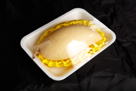 fresh yellow mango with black background, close up.の写真素材