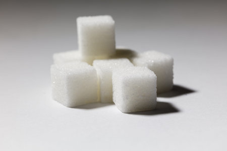 white sugar cubes close up, food concept.の写真素材