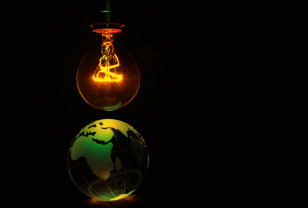 Light bulb and earth, concept of global issues, Europe, Africaの写真素材