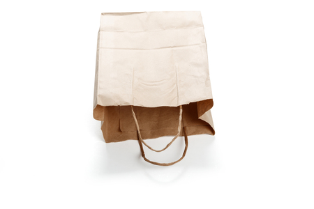 Brown paper bag on white background. close up shotの写真素材