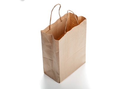 Brown paper bag on white background. close up shotの写真素材