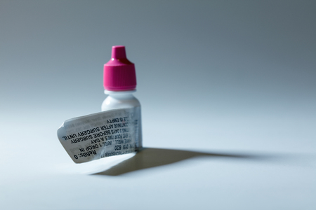 Pink cap eye drop bottle, antibiotic prescription medicine.の写真素材