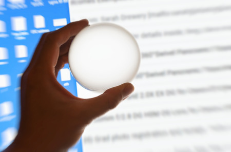 Crystal ball magnify computer screen, communication concept.の写真素材