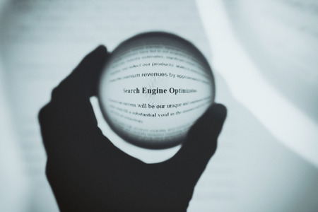 Crystal ball magnify computer screen word Search Engine Optimization.の写真素材