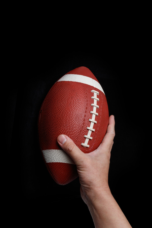 American football isolated on black , close up.の写真素材