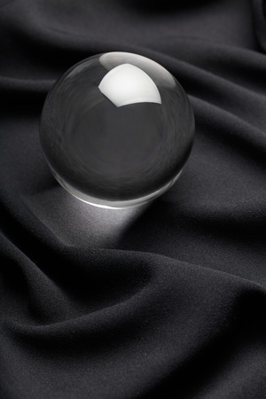 Transparent Crystal ball with black background , close up.の写真素材