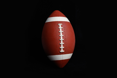 American football isolated on black , close up.の写真素材
