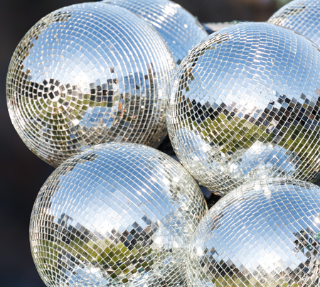Silver disco mirror ball close up shotの写真素材