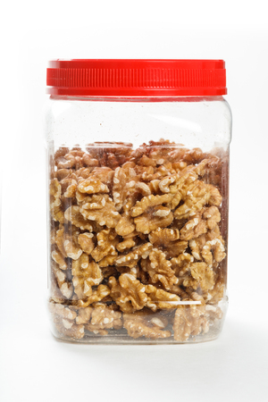 yellow cooked walnut, jar food, close up.の写真素材