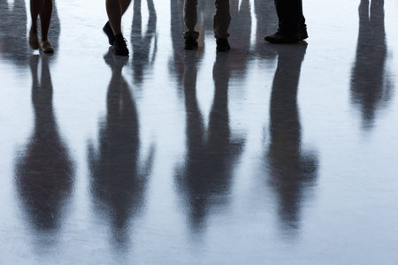 Black shadow of a group people on the ground.の写真素材