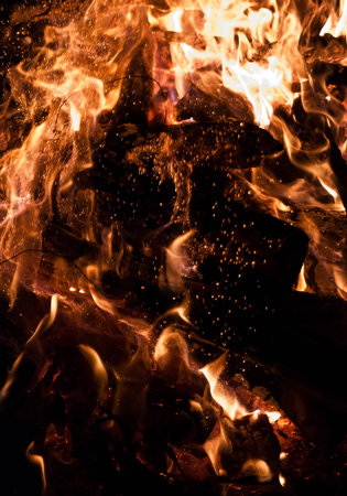 burning charcoal in the background