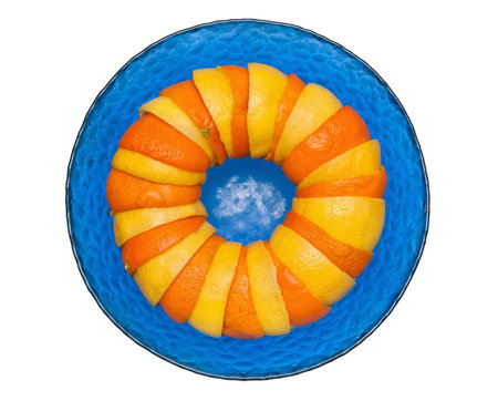 oranges and lemons in glass bowl on a white backgroundの写真素材