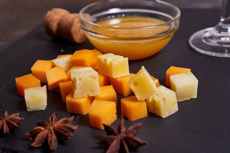 Different types of cheese with honeyの写真素材