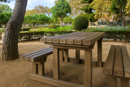 Wooden table and chair in the park, Bangkok, Thailand.