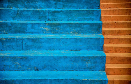Blue seating and red steps in an outdoor stadium