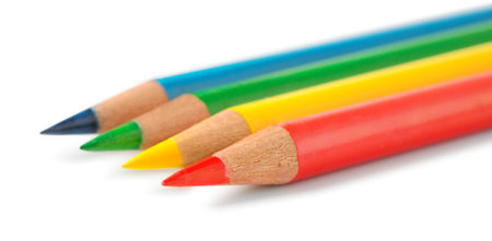 Colored pencils in a row isolated on whiteの写真素材