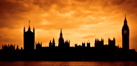 London, UK. Silhouette of the Houses of Parliament and Big Ben across River Thames at sunsetの写真素材