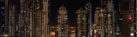 Panorama of new residential buildings in Dubai at nightの写真素材