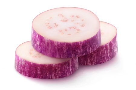 Isolated aubergine pieces. Three slices of purple eggplant isolated on white backgroundの写真素材