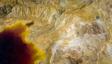 Aerial view of abandoned opencast copper mine in Sia, Cyprus. Unusual colors derives from massive...