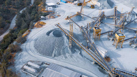 Stock pile and conveyors sorting gravel at stone quarry, aerial viewの写真素材