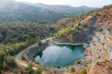 Lake in abandoned pit of basalt quarry near Machairas, Cyprus. Aerial landscape