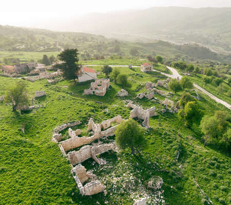 Aerial landscape, old abandoned village with stone buildings in ruinsの写真素材