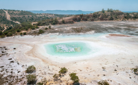 Open pit of old copper mine with dried polluted lake bed in Limni, Cyprus. Aerial landscape