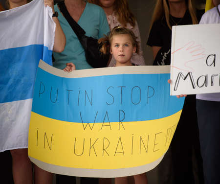 Limassol, Cyprus - April 10, 2022: Ukrainian girl holds anti-war sign at rally in support of Mariupol against Russian invasion of Ukraineのeditorial素材
