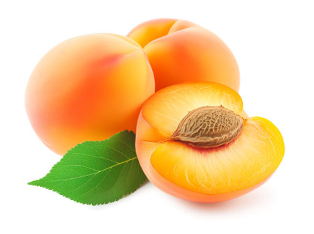 Whole and halved apricots with leaf on white. Generative AIの素材