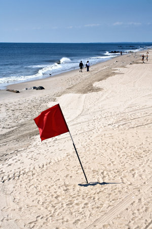 Red flag on the beach, no swimming no bathing.