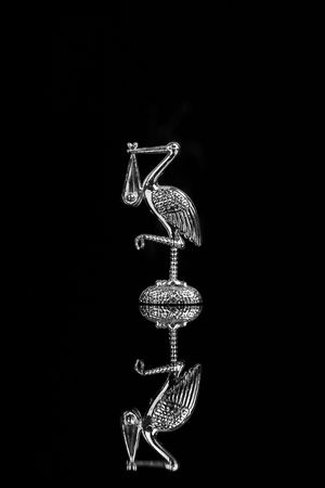 silver stork on the black backgrand -cake decoration and pregnancy symbolの写真素材