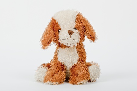 soft toy brown and cream colour dogの写真素材