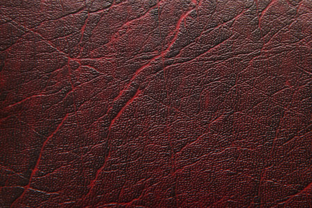 a close up of old burgundy leather texture