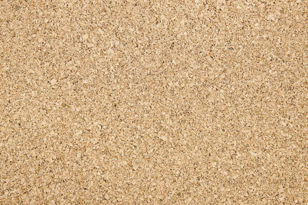a simple beige cork board texture backgroundの写真素材