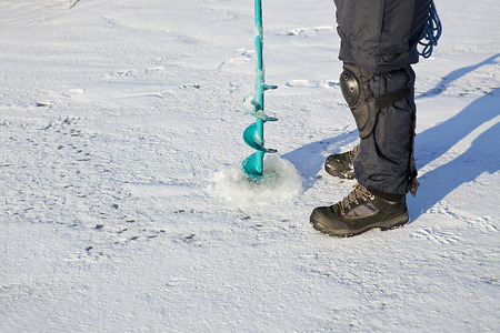 Ice auger -  tool is for drilling  fishing hole in the iceの写真素材