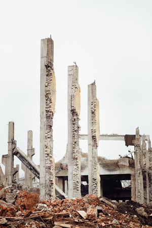 the ruins of an abandoned Soviet Russian industrial Damaged factory. The concept of system failure.の写真素材