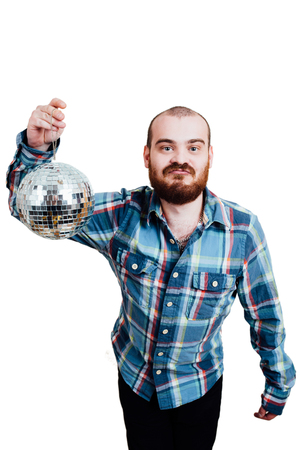 Portrait of a red-bearded, balding male brutal. White isolated background. A man in a blue plaid shirt, holding disco ball in hand. lippedの写真素材