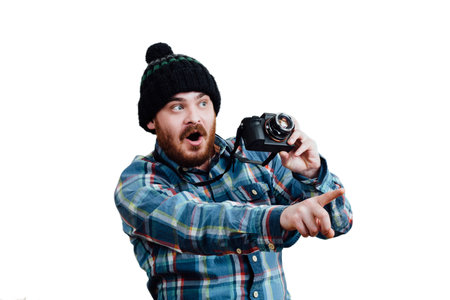 Portrait of a bearded, balding male hipster. White isolated background. A man in a blue plaid shirt...