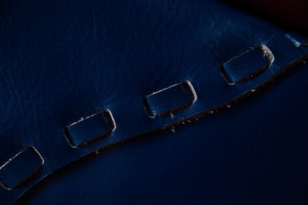 Macro fragment of a leather bag or purse. Handmade, texture background.