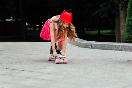 lifestyle, summer and childhood concept - young woman, teenage girl. portrait of stylish little girlの写真素材
