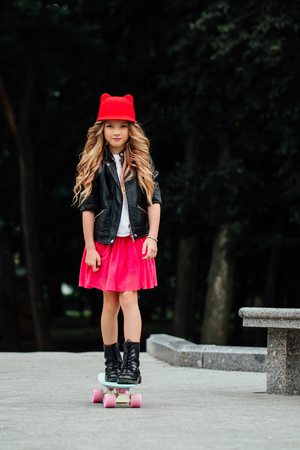 lifestyle, summer and childhood concept - young woman, teenage girl. portrait of stylish little girlの写真素材