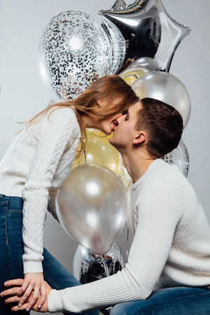 beautiful young attractive couple celebrating a birthday or a Valentines day holiday.の写真素材