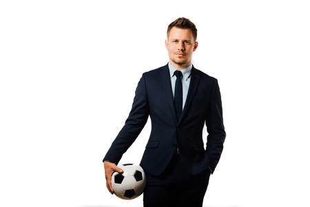 young handsome businessman holding a football isolated on white background studio.の写真素材